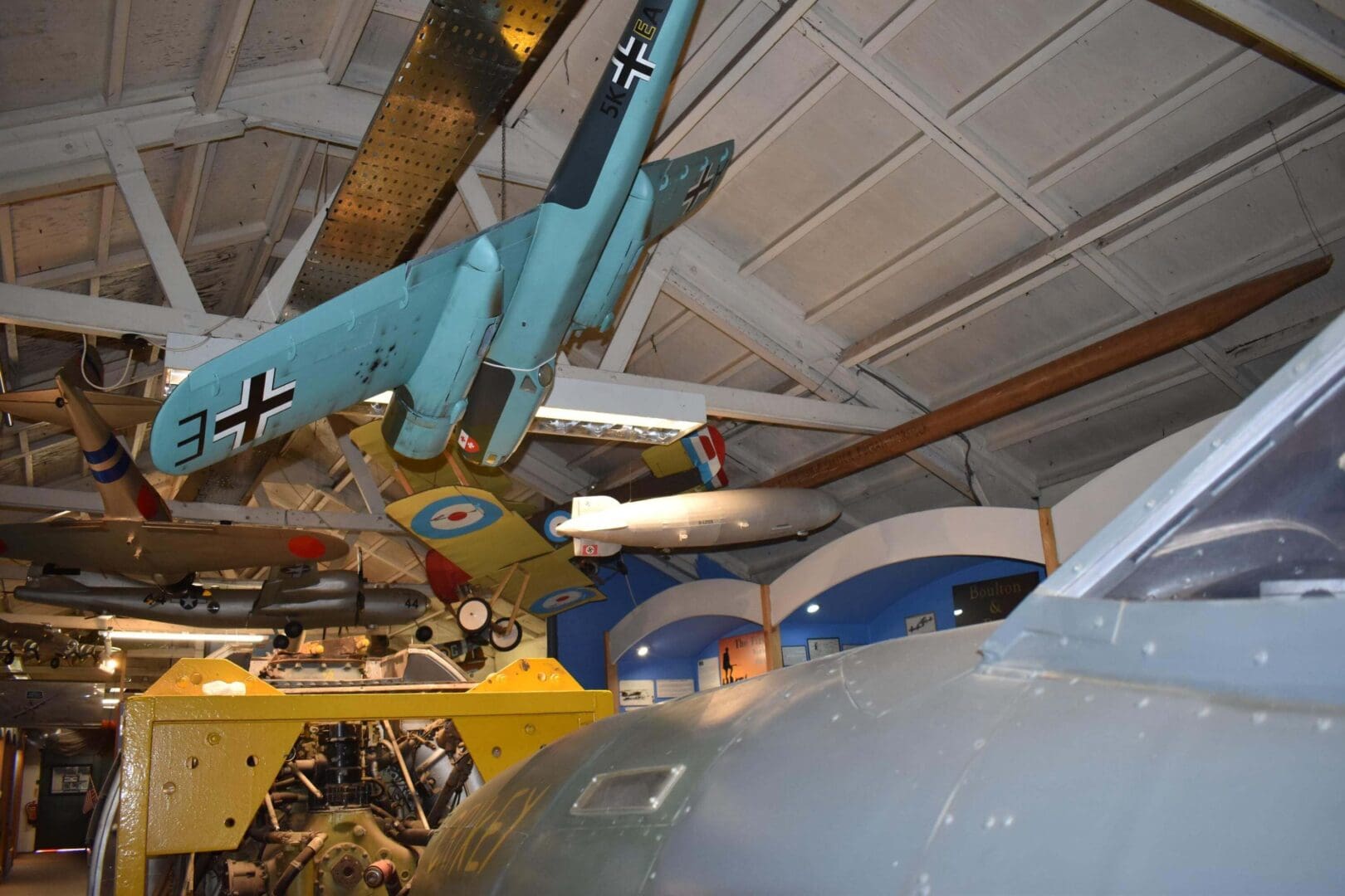 Hanging vintage aircraft in museum display.