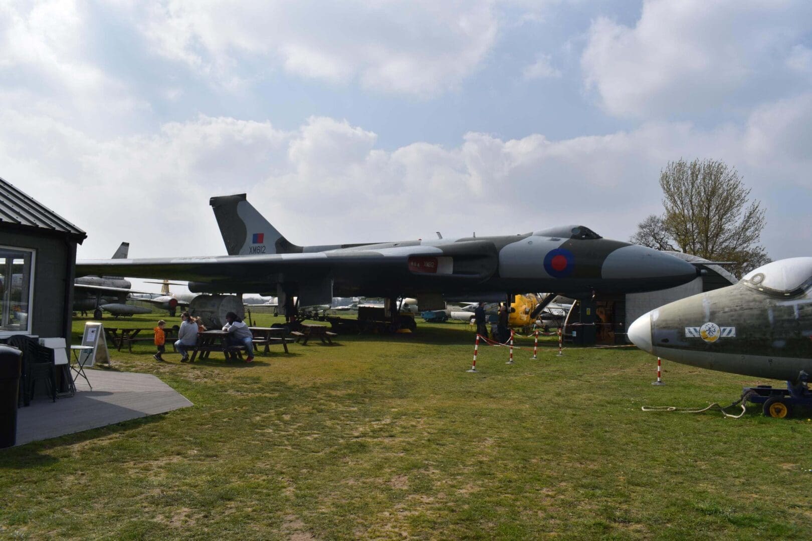 Military aircraft displayed at outdoor museum exhibit.