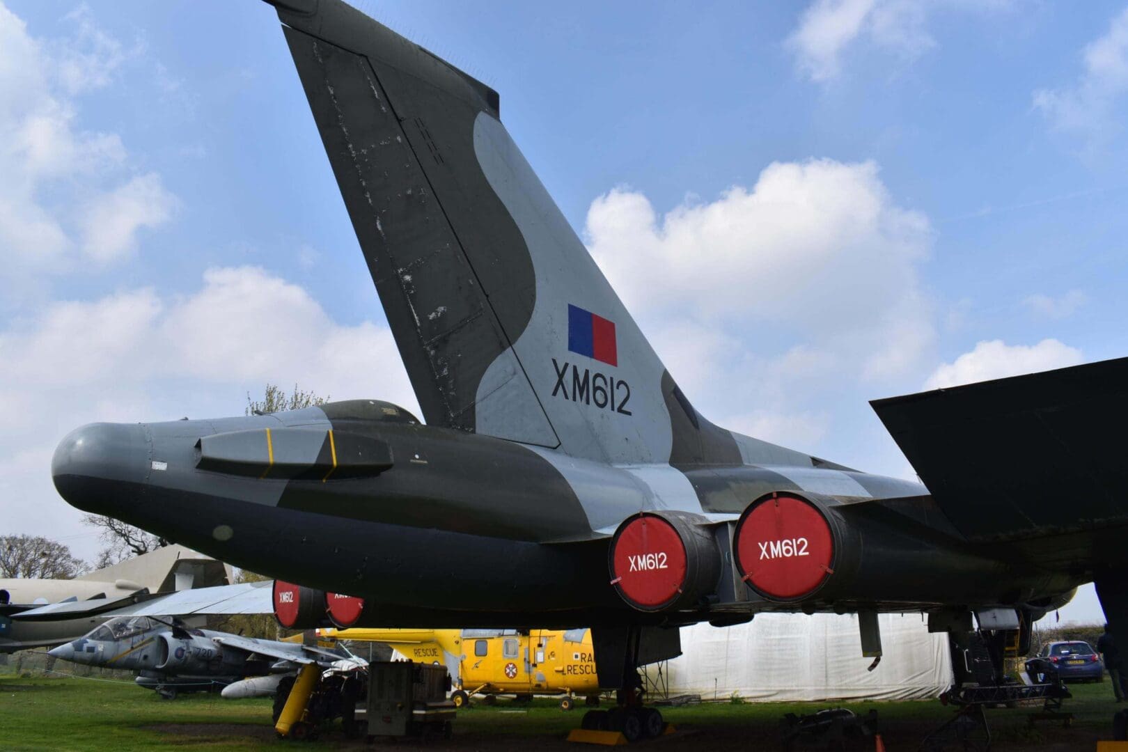 Military aircraft tail with identification markings.