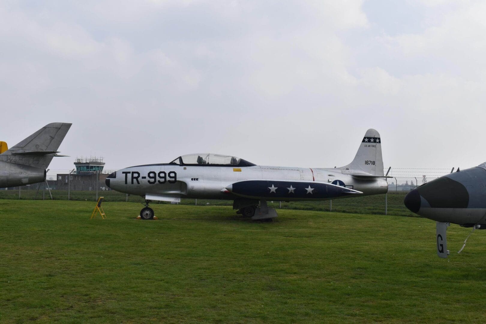 Vintage military aircraft on display outdoors.