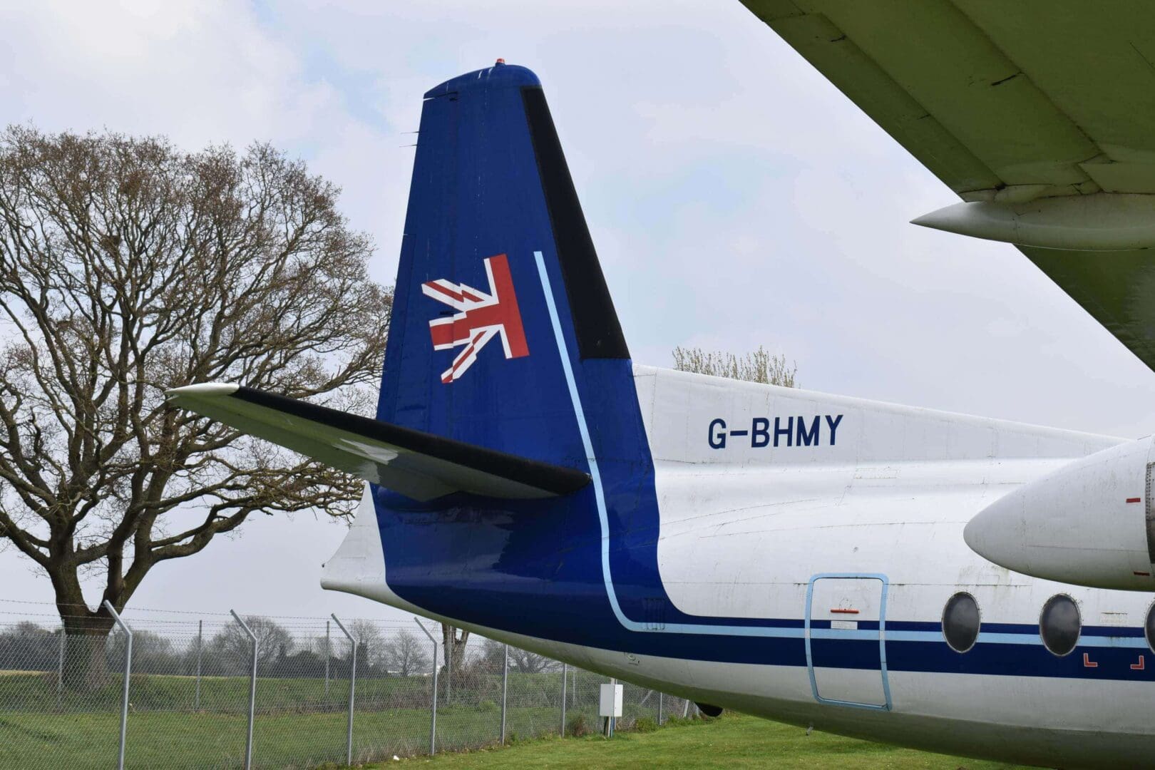 Airplane tail with British flag design.