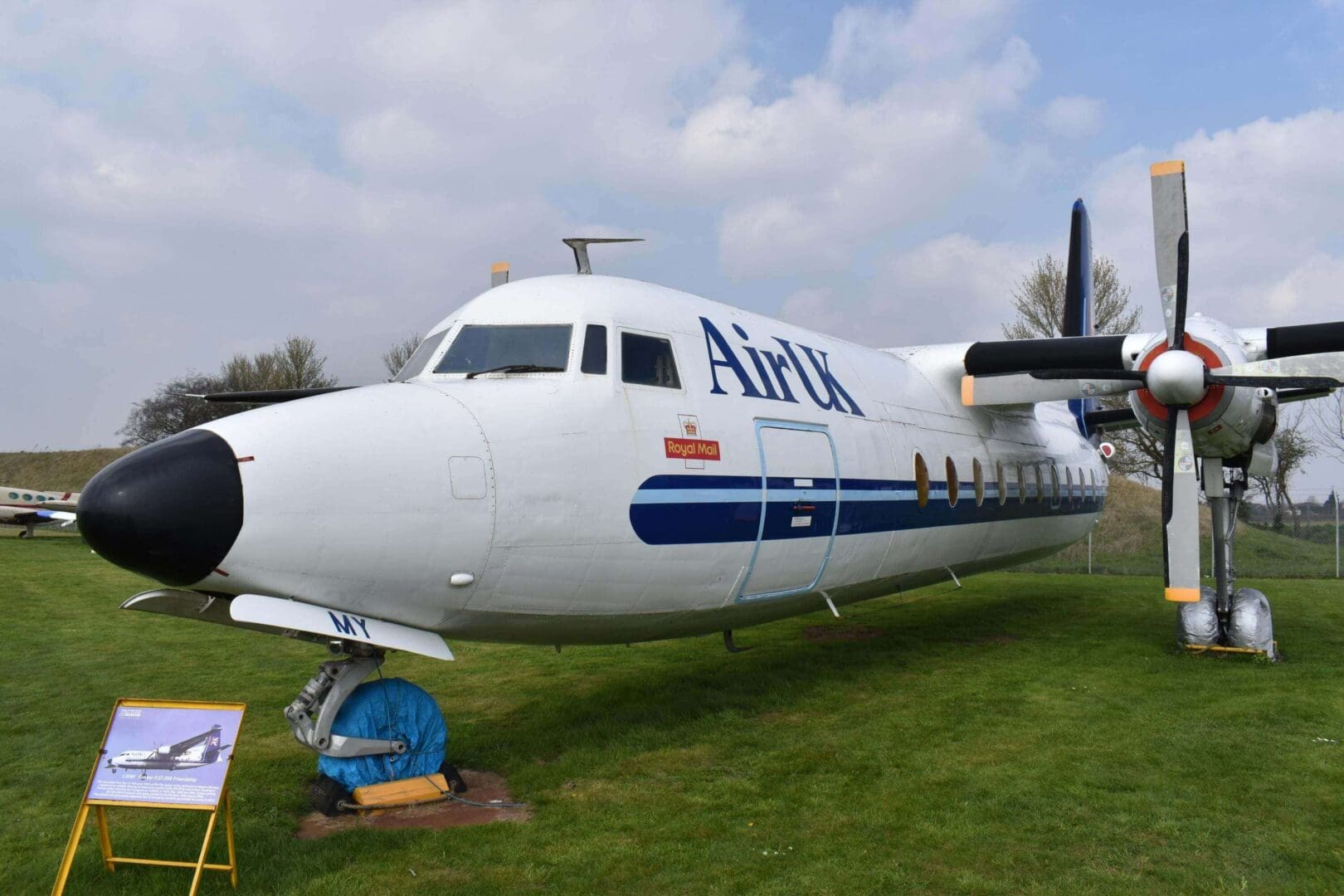 Vintage Air UK airplane on display outdoors.