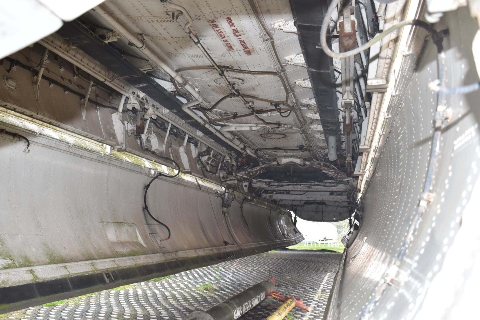Underside view of an aircraft wing.