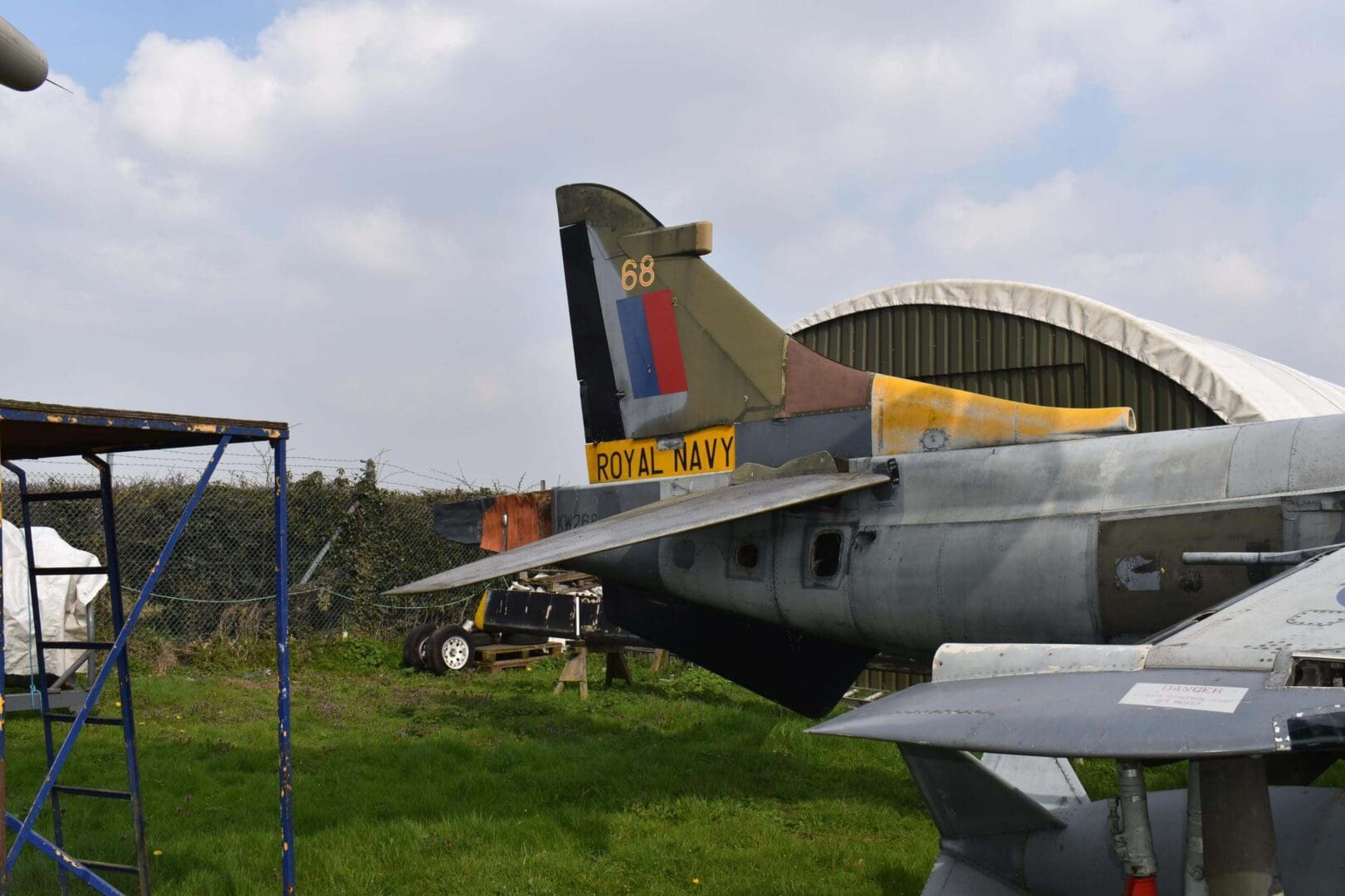 Royal Navy aircraft tail on display outside.