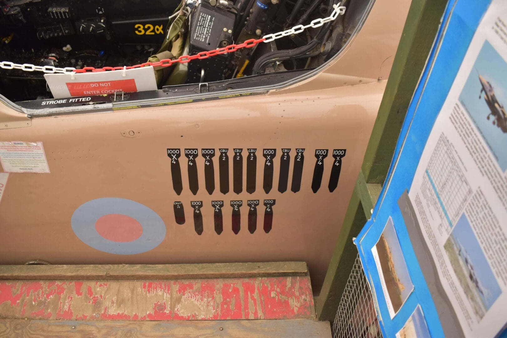 Aircraft cockpit with bomb markings displayed.