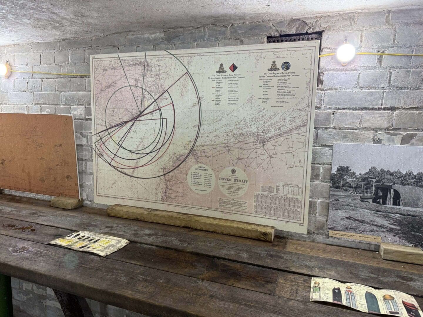 Historical map displayed on rustic wooden table.