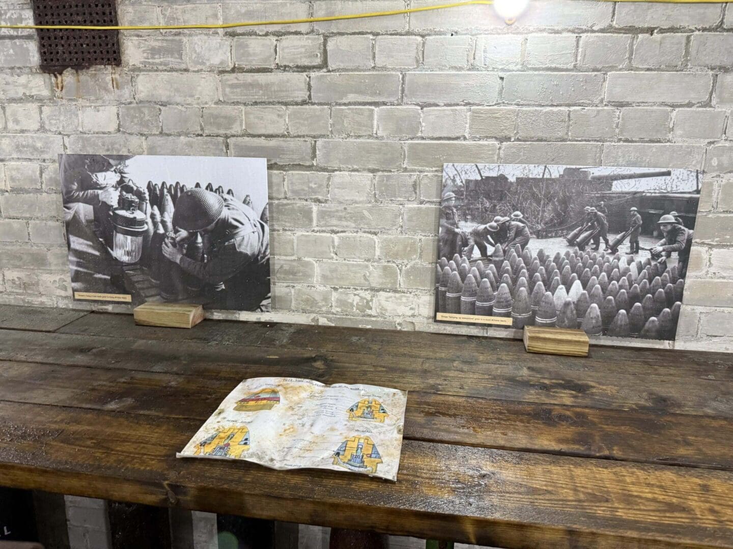 Old photographs and open book on table.