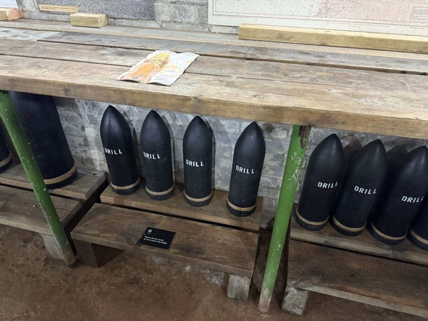 Drill shells on wooden shelves.