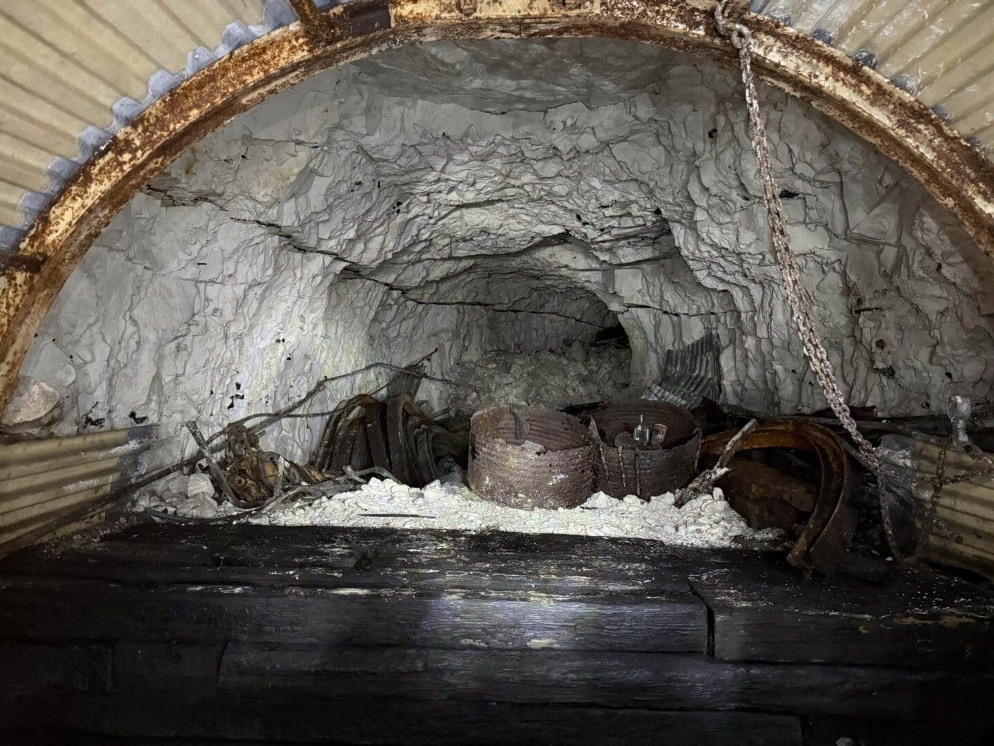 Cave entrance with rocky interior and debris.