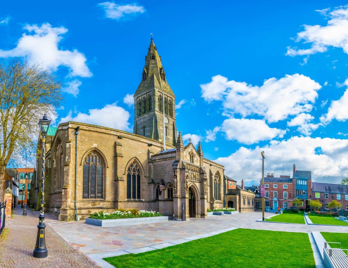 Historic church with tower under blue sky.